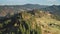 Mountain village at pine forest aerial. Nobody nature landscape. Colorful autumn leaf, conifer trees