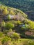 Mountain village in spring greenery. Picturesque ethnic houses on a mountain slope. Dagestan. Vertical view