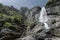 Mountain waterfall seen from below