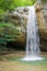 Mountain waterfall vertical in the spring forest