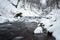 Mountain waterfall at winter. Carpathian mountains, Ukraine