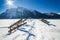 Mountain winter landscape with wooden stairs covered with snow