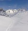 Mountain winter scenery with ski tracks through powder snow. Swiss mountains Wannenhorn Gabelhorn in Wallis in Jungfrau