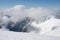 Mountain winter slope in clouds.