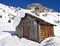 Mountain wooden cabin log in the Dolomites, Passo Fedaia