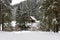 Mountain wooden chalet covered with fresh snow