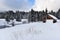 Mountain wooden chalet covered with fresh snow