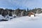 Mountain wooden chalet covered with fresh snow