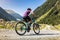 Mountainbiker on a gravel road in the Tyrol Alps, Austria