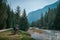 Mountainbiking along river Isar in the Karwendel mountains during blue sky day in summer, Austria