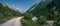 Mountainbiking along river Isar in the Karwendel mountains during blue sky day in summer, Austria