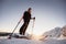 Mountaineer backcountry ski walking in the mountains. Ski touring in high alpine landscape. Adventure winter extreme sport. Sunny