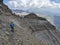 mountaineer on the banderweg path in the direction of Bifertenstock Piz Durschin. High tour in the mountains of Glarus