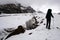 Mountaineer climbing Mount Kazbek and deep glacier crack