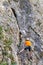 Mountaineer climbing Sohodol Gorges rocky slopes