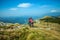 Mountaineer couple on the Nanos plateau in Slovenia overlooking the beautiful Vipava Valley