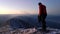 Mountaineer on the frozen ridge in mountains