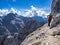 Mountaineer just below the top of the Prisojnik mountain in Julian Alps enjoying the view