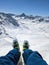 mountaineer lets his feet shake on the summit of Jorihor. legs shaking. Enjoy the mountains Ski touring in Switzerland.