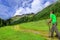 Mountaineer with poles on alpine trail, Austria