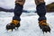Mountaineer`s feet with crampons on the frozen glacier, Vatnajokull