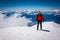 Mountaineer on snowy mountain top.