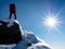 Mountaineer standing at the top of the mountain.