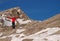 Mountaineer on top of mountain in winter