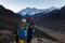 Mountaineer walking mountain trail above Lungde village, Nepal.