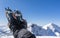 Mountaineering boots with automatic crampons on the background of mountains.