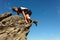 Mountaineering in the Carpathians, a man climbs a rocky peak without protection, alone, amateur mountaineering