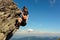 Mountaineering in the Carpathians, a man climbs a rocky peak without protection, alone, amateur mountaineering