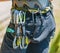 Mountaineering safety equipment hanging on harness