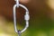 Mountaineering safety hook macro attached to metal chain