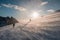 Mountaineers climbing in blizzard snowy hill at sunset