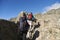 Mountaineers hiking amidst a rocky mountain landscape in Los Gigantes, Argentina