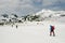 Mountaineers traversing an iced lake in Retezat Mountains..