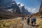 Mountaineers walk among beautiful mountain landscape