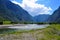 Mountainous Altai Russia - August 2017 view of the mountain river flowing between the high Altai mountains in a bright sunny day a