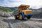 The mountainous dump truck is widely used for transporting and unloading rocks