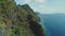 Mountainous island landscape with green tropic jungle forest. Asia seascape of ocean bay