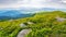 mountainous landscape with grassy rolling hills