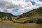 Mountainous landscape with partly cloudy sky