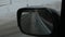 Mountainous landscape reflection in the side rearview mirror of the car. winter season. slow motion