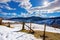 mountainous rural landscape on a sunny winter day. fields and trees on rolling hills covered in snow