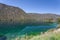 Mountainous scenery reflecting in the Thompson river under the clear sky