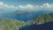 Mountainous tropic island at ocean bay aerial rise up view. Mountain range at tropic isle of El Nido