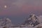 Mountains of the Antarctic Peninsula in the red sunset in the mo