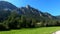 Mountains in Austria with green forests and meadows at dusk in 4k