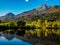 Mountains in autumn colors reflecting the lake